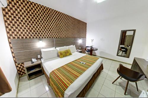 Ένα ή περισσότερα κρεβάτια σε δωμάτιο στο Hotel Solar Rio de Pedras