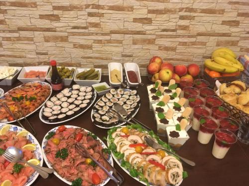 a table topped with lots of different types of food at Penzion Vesely in Železný Brod