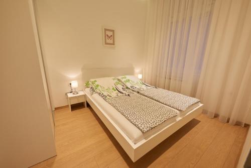 Кровать или кровати в номере Apartments Sarajevo City Hall