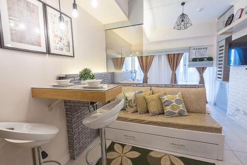 a bathroom with a sink and a toilet at Light and Chic - Tagaytay Vacation Pad in Tagaytay
