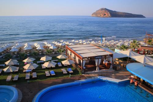 an aerial view of a resort with a swimming pool and the ocean at Thalassa Beach Resort & Spa (Adults Only) in Agia Marina Nea Kydonias