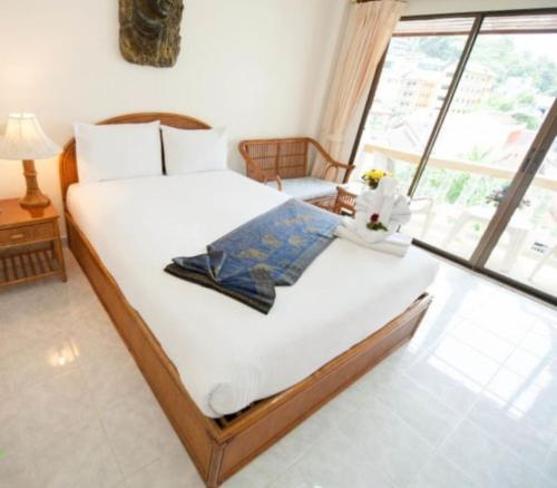 
A bed or beds in a room at Palmview Resort
