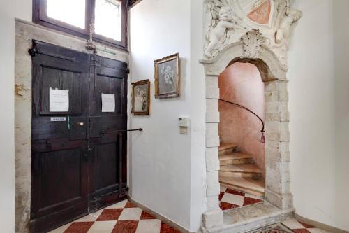 an entrance to a building with a wooden door at Nobile House in Venice