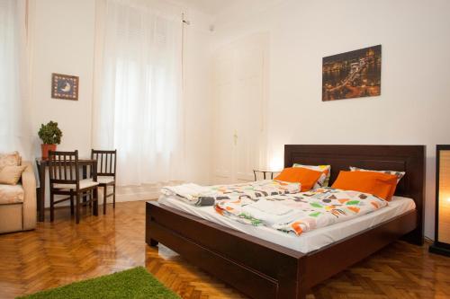 a bedroom with a bed and a living room at Ariel Studio Close to St. Stephen Basilica in Budapest