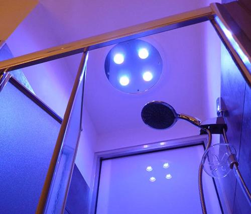 a shower in a room with purple lighting at Villino Erminia - Seaside Art b&b in Pizzo
