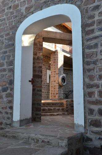 an archway in a brick wall with a camera at Seeheim Hotel in Seeheim