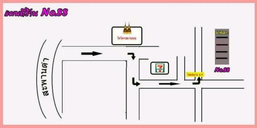 a diagram of a room with two tables and a sign at T.M. Home, Hatyai in Hat Yai