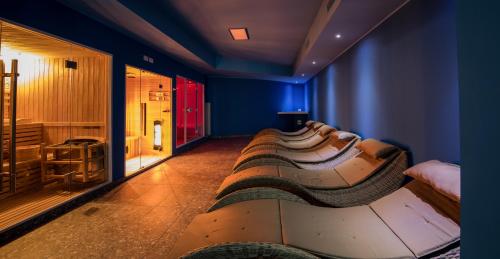 a room with a row of shoes on the floor at Yachting Residence in Lavena Ponte Tresa