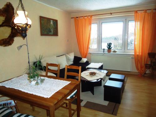 a living room with a table and a couch at Zeche 33 in Kurort Oberwiesenthal