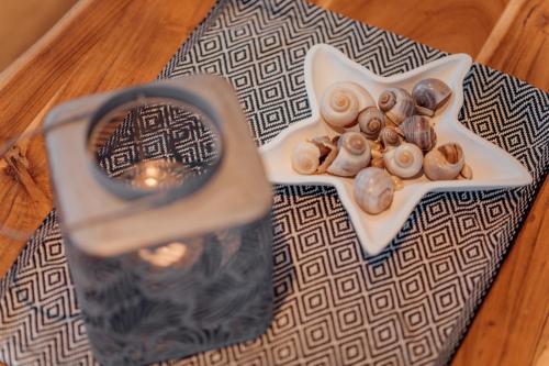 a plate of mushrooms on a table with a magnifying glass at Goitzsche Resort in Bitterfeld