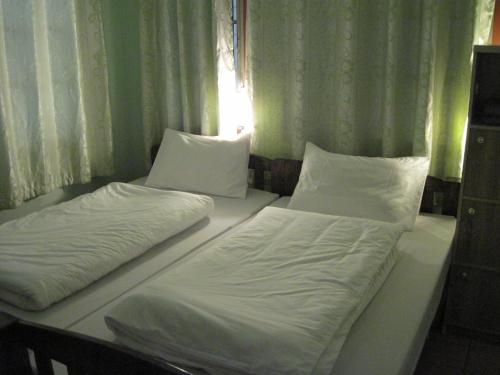 Cama o camas de una habitación en Sakura House