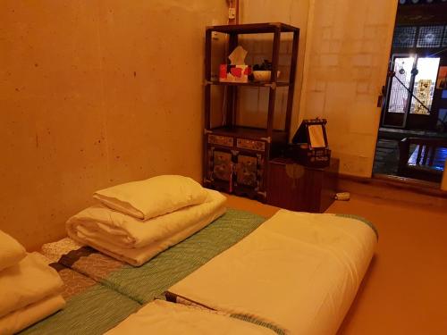 Postel nebo postele na pokoji v ubytování Gongsimga Hanok Guesthouse
