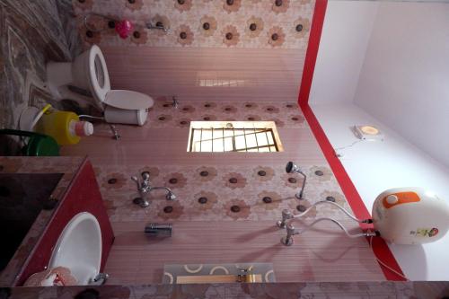 a model of a bathroom with a shower and a sink at Asian Grand Villa in Bolpur
