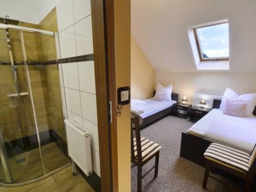 Postel nebo postele na pokoji v ubytování Sum Restauracja & Hotel