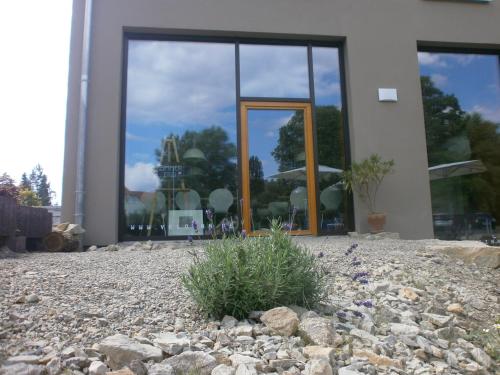 a building with a large window on the side of it at veloInn Hotel Bad Berka im Weimarer Land in Bad Berka