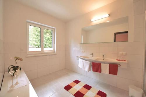 Ванна кімната в Appartementhaus Mira Monti