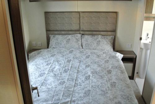 Ένα ή περισσότερα κρεβάτια σε δωμάτιο στο St Andrews Holiday Home