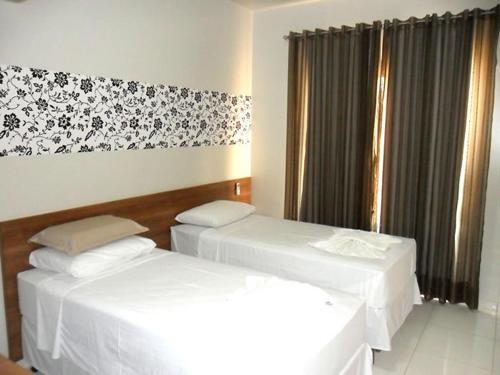 Postel nebo postele na pokoji v ubytování Hotel LG