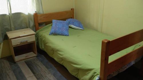 מיטה או מיטות בחדר ב-Casa en zona tranquila y rural
