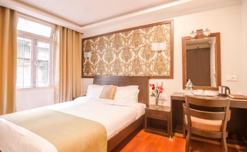 Ένα ή περισσότερα κρεβάτια σε δωμάτιο στο Hotel Sher-E-Punjab & Spa