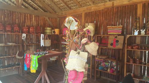 a store with a bunch of hats and other items at Anjiamarango Beach Resort in Nosy Be