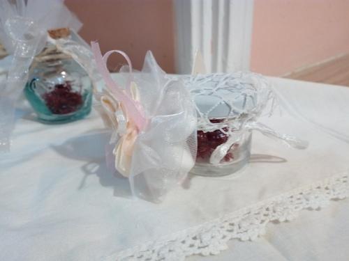 a table with two glass jars with strawberries in them at Casa Vacanze Il Castello in Pescina