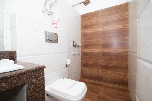 a bathroom with a toilet and a shower at Hotel Sher-E-Punjab & Spa in Gangtok