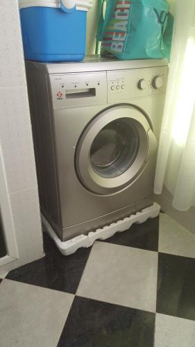 a washer and dryer sitting in a room at Addoha Apartment in Tangier
