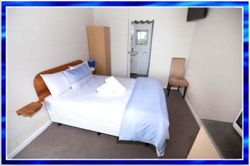 Ένα ή περισσότερα κρεβάτια σε δωμάτιο στο Tuross Head Motel