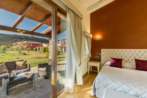 Postel nebo postele na pokoji v ubytování Hotel Sa Cheya Relais & Spa