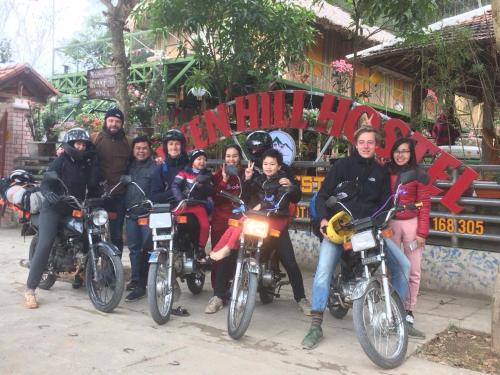 a group of people sitting on their motorcycles at Green Hill Hostel & Tour in Ha Giang