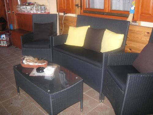 a living room with a couch and chairs and a table at Apartment Medo in Ravna Gora