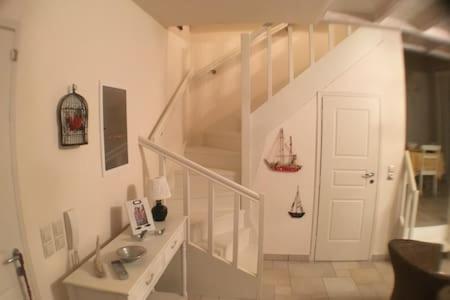 a white staircase with a sink in a room at Villa Costa Hydra in Plépi