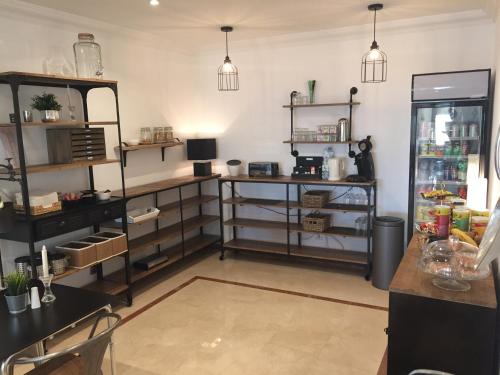 a large room with shelves and a refrigerator at Villa Mañana in Mijas