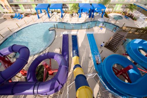 an overhead view of a pool with a water slide at Ramada by Wyndham Flamingo Water Park in Kissimmee