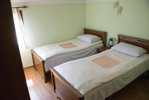 a room with two beds and a window at B&B Odzun in Odzun