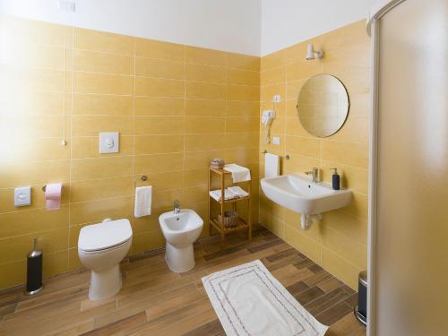 a bathroom with a toilet and a sink at La nostra casa in centro in Lecco