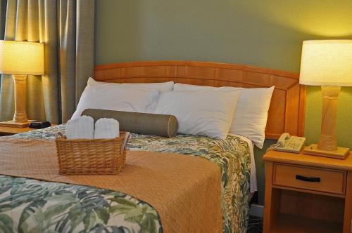 a bedroom with a bed with a basket on it at Aquamarine Villas in Oceanside
