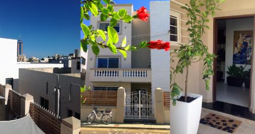 a view of a building with flowers on a balcony at 8villa in St Julian's