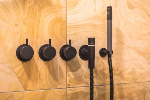 a row of pots and pans hanging on a wall at Landgoed Kasteel de Hoogenweerth in Maastricht