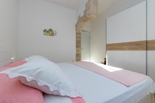 Postel nebo postele na pokoji v ubytování Apartmani Meriko