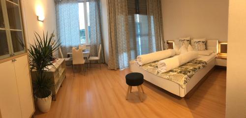 Ένα ή περισσότερα κρεβάτια σε δωμάτιο στο Living Apartment Central