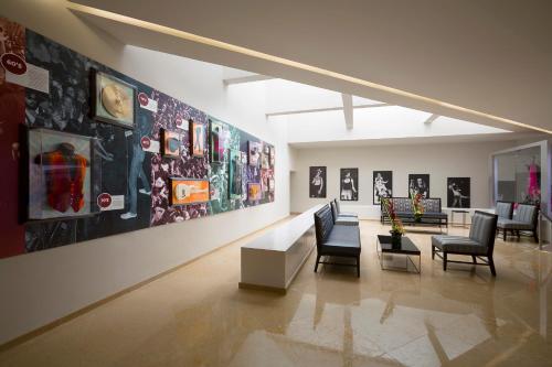 a room with chairs and pictures on the wall at Hard Rock Hotel Vallarta All Inclusive in Nuevo Vallarta 