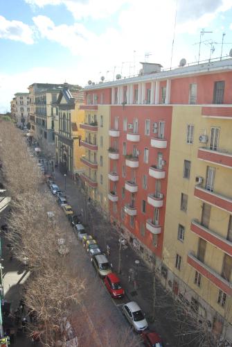 a city street with cars parked in front of buildings at 7th Floor Suite in Naples
