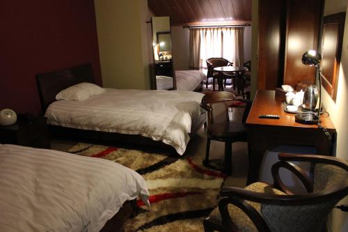 Postel nebo postele na pokoji v ubytování Kanaan Group Hotel