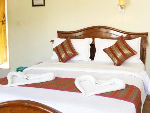 Una cama o camas en una habitación de Hotel Grand Holiday