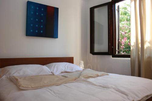 En eller flere senge i et værelse på Apartment Sommer