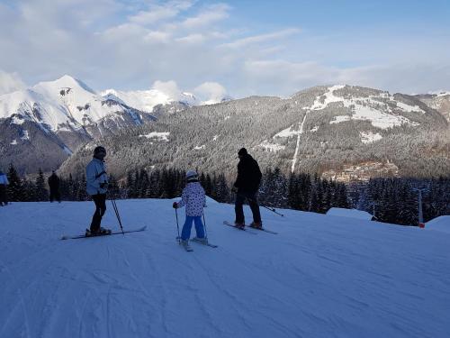 a group of three people on skis in the snow at Le Marquis in Morzine