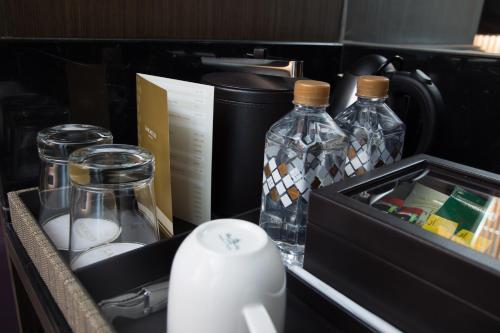 a drawer filled with bottles and a box of milk at Lancaster Bangkok in Bangkok