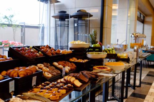 a buffet line with many different types of pastries at Lancaster Plaza Beirut in Beirut